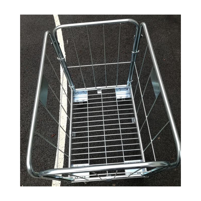 Žičnati voziček za pralnice, narejen iz okroglih profilov, z dvema  stranskima, eno zadnjo in sprednjo steno, modro cinkan  Nosilnost 300 kg.
